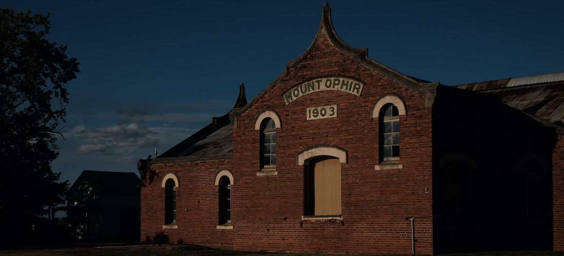 Night shot of brick facade of the winery